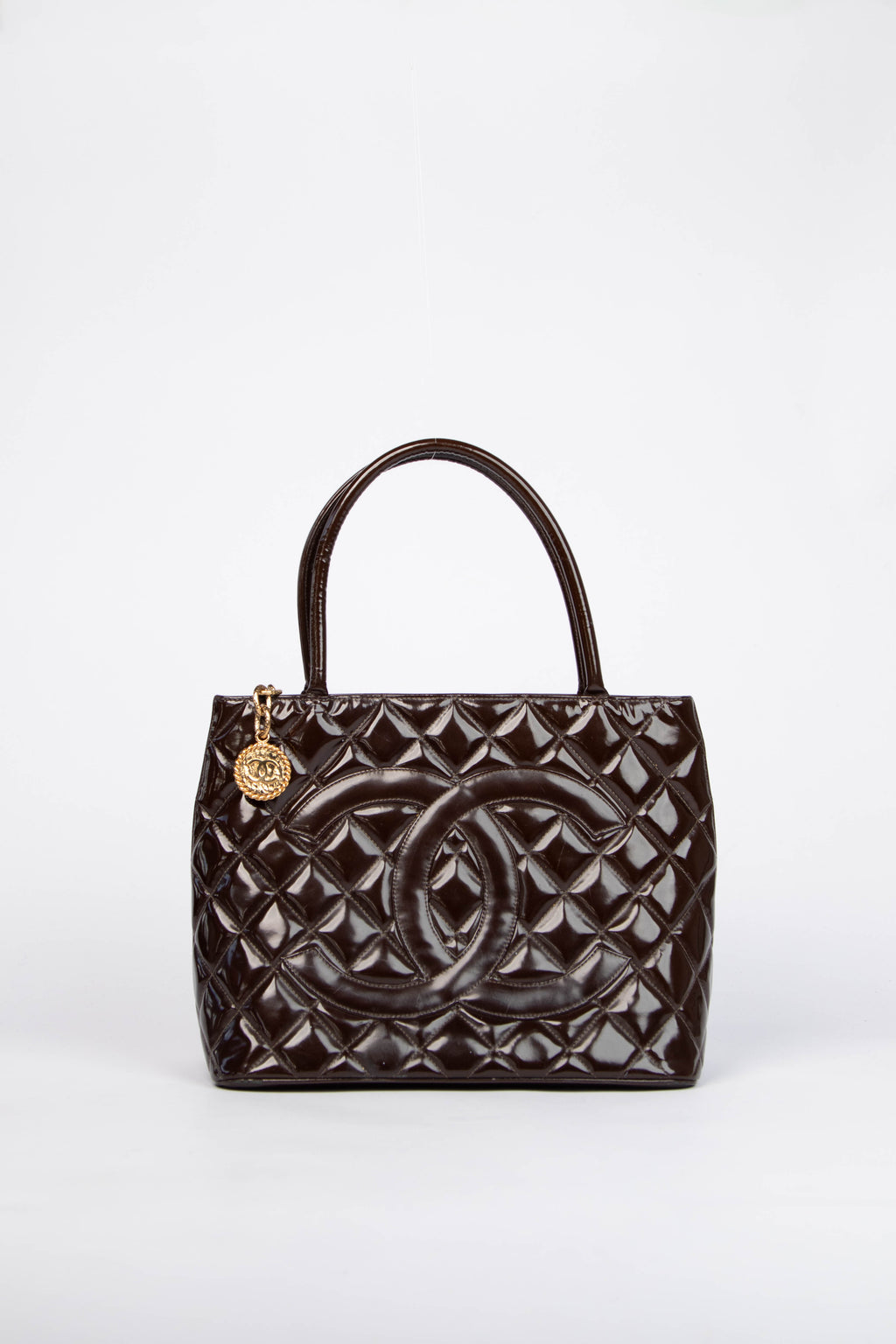 2000s Chanel Brown Patent Leather Gold Medallion Tote Bag