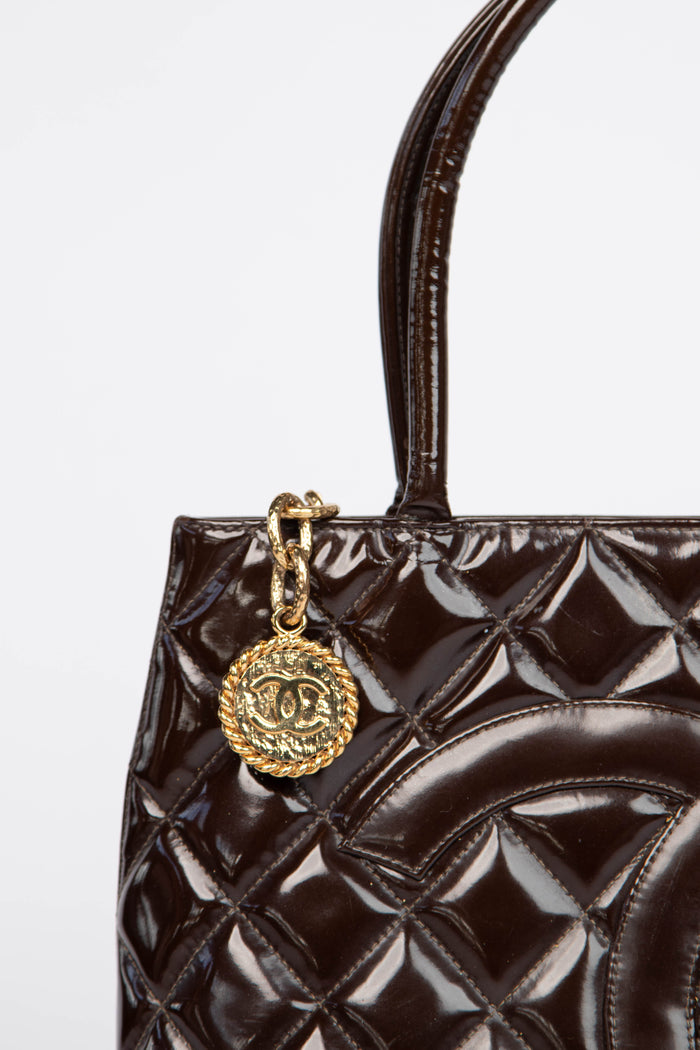 2000s Chanel Brown Patent Leather Gold Medallion Tote Bag